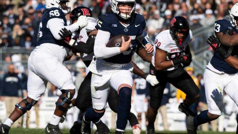 Penn State quarterback Drew Allar keeps the ball on the ground during an NCAA football game against Rutgers Saturday, Nov. 18, 2023, in State College, Pa. The Nittany Lions won, 27-6.