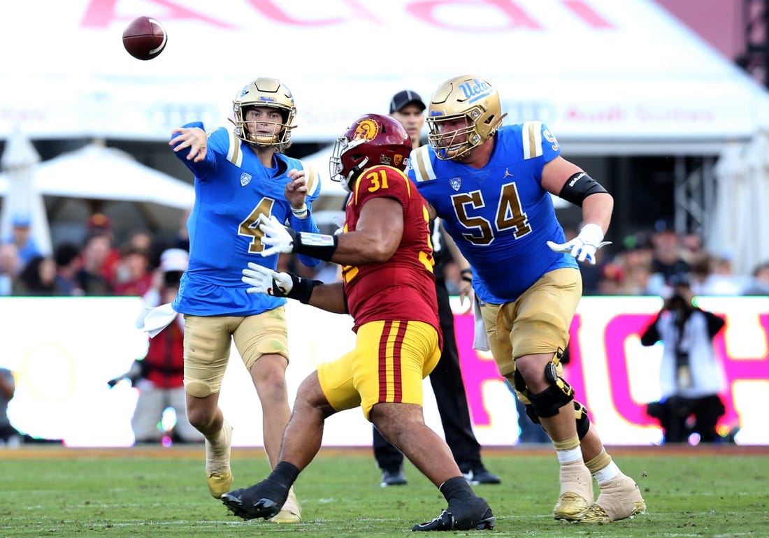 Nov 18, 2023; Los Angeles, California, USA; UCLA Bruins quarterback Ethan Garbers (4) throws during the second quarter against the USC Trojans at United Airlines Field at Los Angeles Memorial Coliseum. Mandatory Credit: Jason Parkhurst-USA TODAY Sports