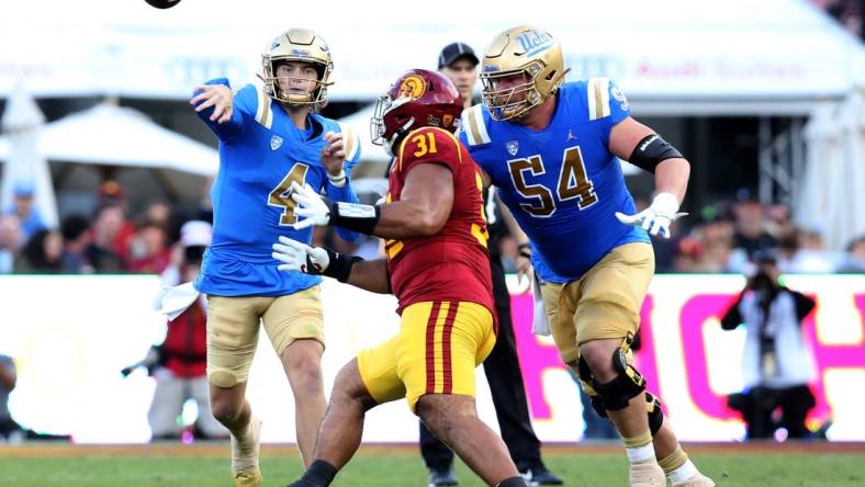 Nov 18, 2023; Los Angeles, California, USA; UCLA Bruins quarterback Ethan Garbers (4) throws during the second quarter against the USC Trojans at United Airlines Field at Los Angeles Memorial Coliseum. Mandatory Credit: Jason Parkhurst-USA TODAY Sports