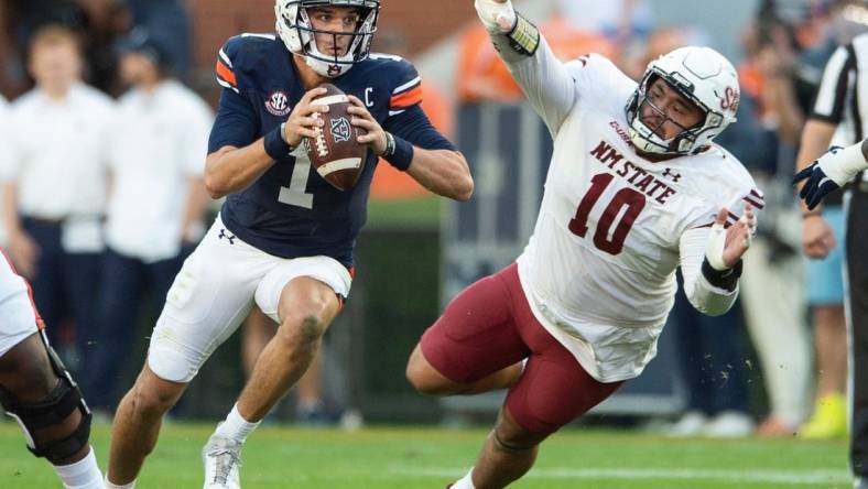 Auburn Tigers quarterback Payton Thorne (1) scrambles up the middle as Auburn Tigers take on New Mexico State Aggies at Jordan-Hare Stadium in Auburn, Ala., on Saturday, Nov. 18, 2023. New Mexico State Aggies leads Auburn Tigers 10-7 at halftime.