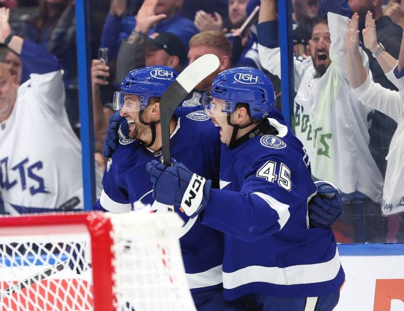 Nov 18, 2023; Tampa, Florida, USA; Tampa Bay Lightning center Luke Glendening (11) is congratulated after he scored goal against the Edmonton Oilers during the third period at Amalie Arena. Mandatory Credit: Kim Klement Neitzel-USA TODAY Sports