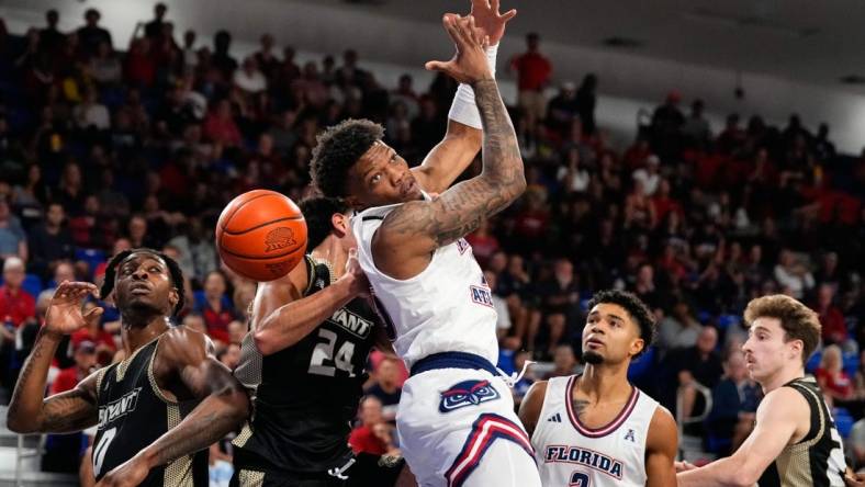 Nov 18, 2023; Boca Raton, Florida, USA; Florida Atlantic Owls guard Alijah Martin (15) attempts to grab a rebound against the Bryant University Bulldogs during the first half at Eleanor R. Baldwin Arena. Mandatory Credit: Rich Storry-USA TODAY Sports