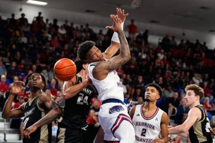 Nov 18, 2023; Boca Raton, Florida, USA; Florida Atlantic Owls guard Alijah Martin (15) attempts to grab a rebound against the Bryant University Bulldogs during the first half at Eleanor R. Baldwin Arena. Mandatory Credit: Rich Storry-USA TODAY Sports