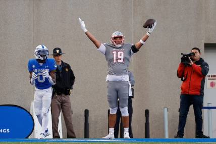 UNLV Rebels tight end Kaleo Ballungay (19) reacts after his touchdown against Air Force Falcons defensive back Trey Williams (0) in the third quarter at Falcon Stadium. Mandatory Credit: Isaiah J. Downing-USA TODAY Sports