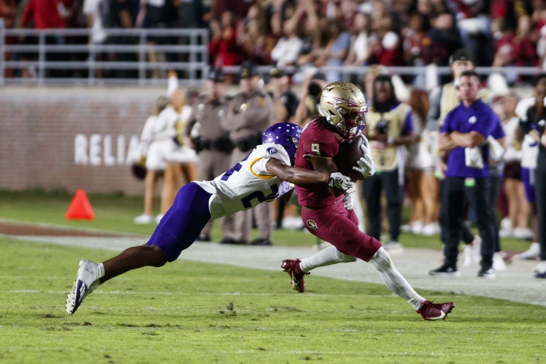 Nov 18, 2023; Tallahassee, Florida, USA; Florida State Seminoles running back Lawrance Toafili (9) tackled by North Alabama Lions defensive back Cameron Jamar (24) during the second quarter at Doak S. Campbell Stadium. Mandatory Credit: Morgan Tencza-USA TODAY Sports