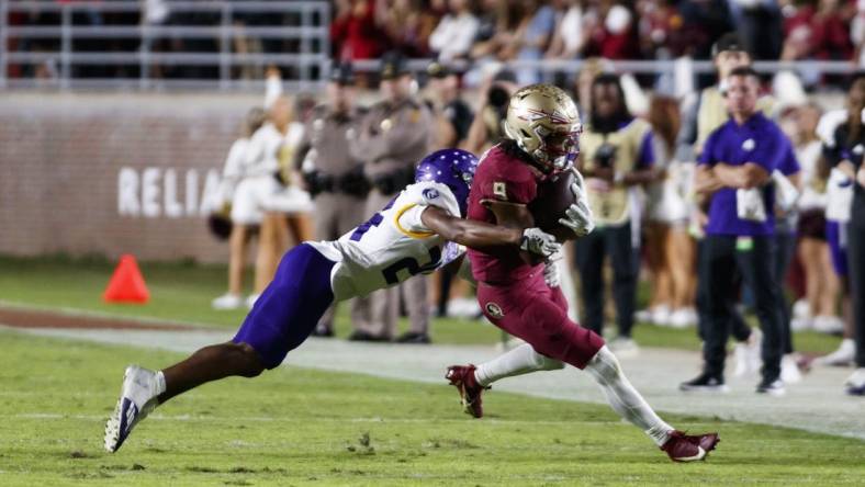 Nov 18, 2023; Tallahassee, Florida, USA; Florida State Seminoles running back Lawrance Toafili (9) tackled by North Alabama Lions defensive back Cameron Jamar (24) during the second quarter at Doak S. Campbell Stadium. Mandatory Credit: Morgan Tencza-USA TODAY Sports