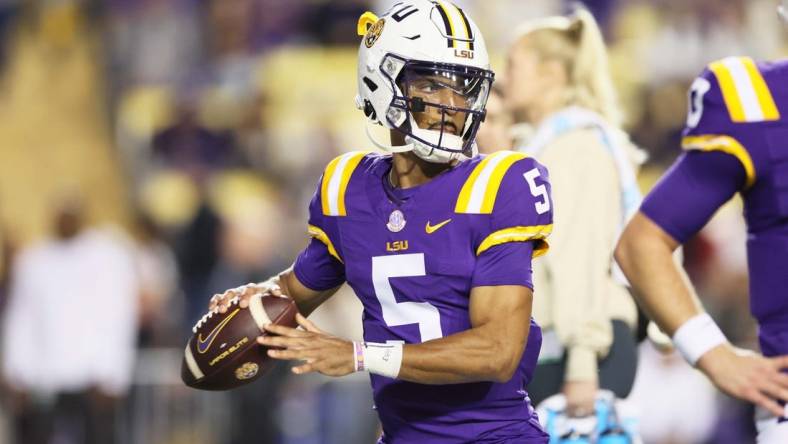 Nov 18, 2023; Baton Rouge, Louisiana, USA; Heisman Trophy candidate LSU Tigers quarterback Jayden Daniels (5) warms up before their game against the Georgia State Panthers at Tiger Stadium. Mandatory Credit: Matthew Dobbins-USA TODAY Sports