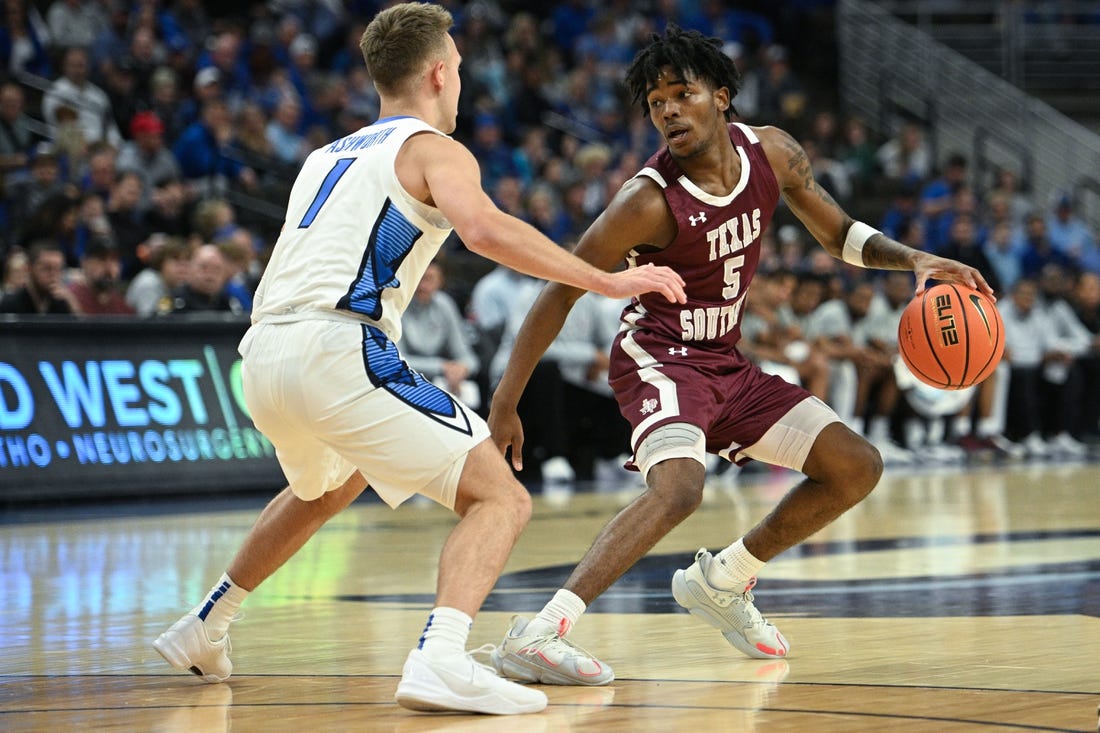 Nov 18, 2023; Omaha, Nebraska, USA; Texas Southern Tigers guard Jaylen Wysinger (5) dribbles against Creighton Bluejays guard Steven Ashworth (1) in the first half at CHI Health Center Omaha. Mandatory Credit: Steven Branscombe-USA TODAY Sports