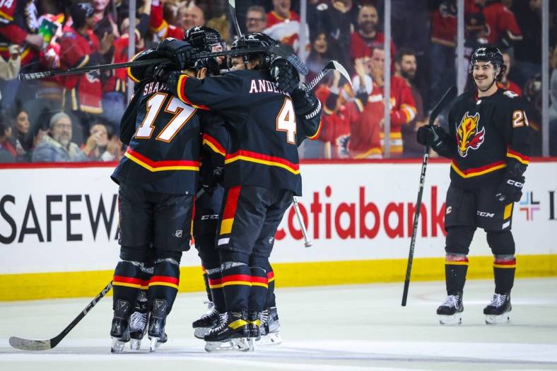 Nov 18, 2023; Calgary, Alberta, CAN; Calgary Flames center Yegor Sharangovich (17) celebrates his goal with teammates against the New York Islanders during the third period at Scotiabank Saddledome. Mandatory Credit: Sergei Belski-USA TODAY Sports