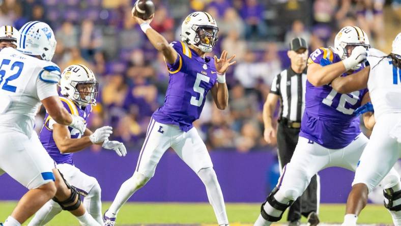 Quarterback Jayden Daniels 5 throws a pass as the LSU Tigers take on Georgia State in Tiger Stadium in Baton Rouge, Louisiana, November 18, 2023.