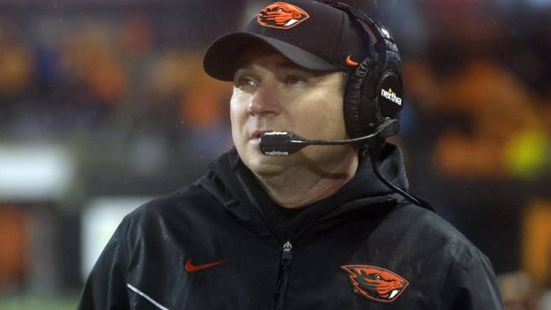 Nov 18, 2023; Corvallis, Oregon, USA; Oregon State Beavers head coach Jonathan Smith looks up at the video board during the second half against the Washington Huskies at Reser Stadium. Mandatory Credit: Soobum Im-USA TODAY Sports