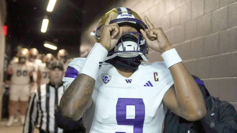 Nov 18, 2023; Corvallis, Oregon, USA; Washington Huskies  quarterback Michael Penix Jr. (9) walks out of the team tunnel before the game against the Oregon State Beavers at Reser Stadium. Mandatory Credit: Soobum Im-USA TODAY Sports