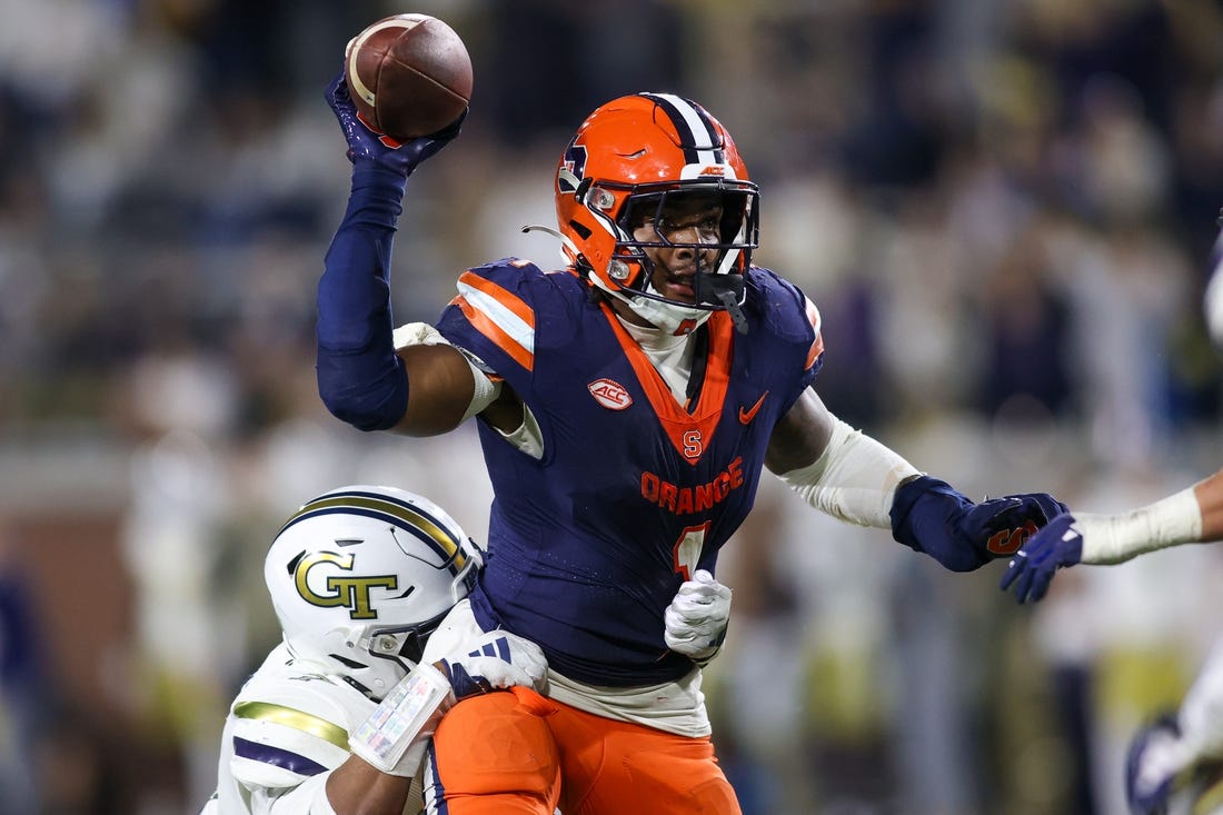 Nov 18, 2023; Atlanta, Georgia, USA; Syracuse Orange running back LeQuint Allen (1) is pressured by Georgia Tech Yellow Jackets linebacker Trenilyas Tatum (7) in the second half at Bobby Dodd Stadium at Hyundai Field. Mandatory Credit: Brett Davis-USA TODAY Sports