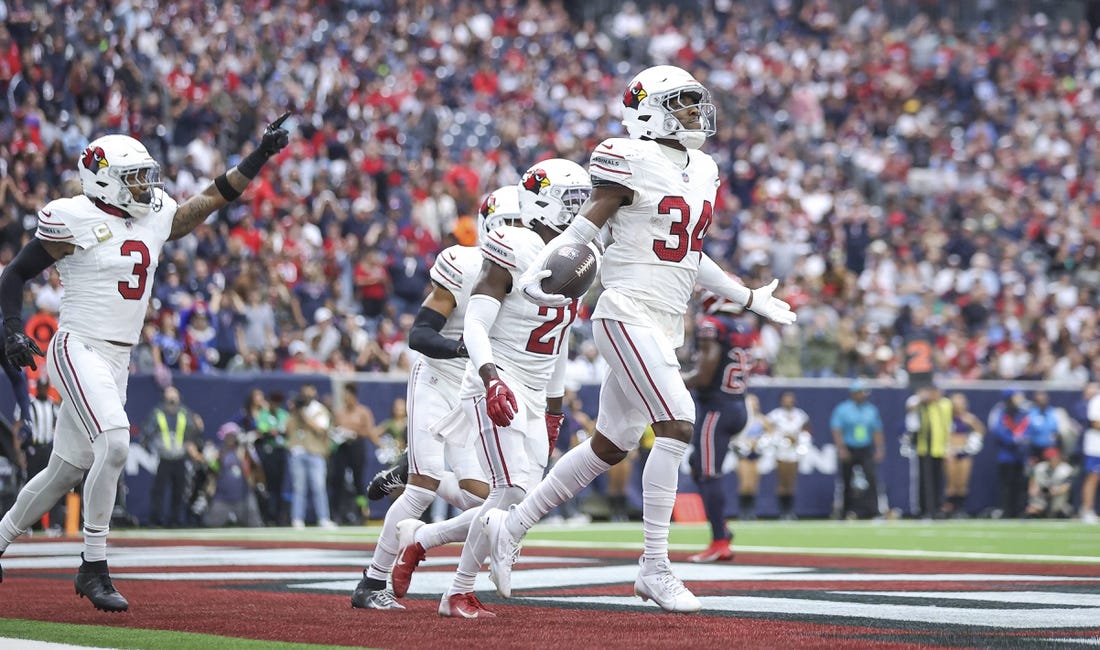 Nov 19, 2023; Houston, Texas, USA; Arizona Cardinals safety Jalen Thompson (34) reacts after making an interception during the second quarter against the Houston Texans at NRG Stadium. Mandatory Credit: Troy Taormina-USA TODAY Sports