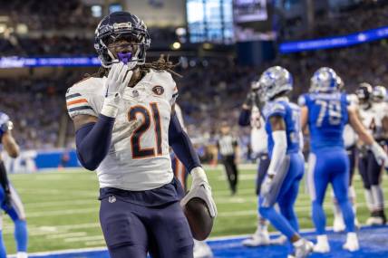 Nov 19, 2023; Detroit, Michigan, USA; Chicago Bears running back D'Onta Foreman (21) runs with the ball for a touchdown against the Detroit Lions and blows kisses to the fans during the first half at Ford Field. Mandatory Credit: David Reginek-USA TODAY Sports