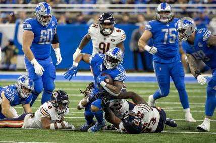 Nov 19, 2023; Detroit, Michigan, USA; Detroit Lions running back David Montgomery (5) runs with the ball against the Chicago Bears during the first half at Ford Field. Mandatory Credit: David Reginek-USA TODAY Sports