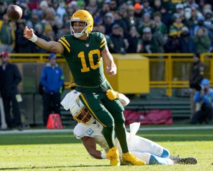 Green Bay Packers quarterback Jordan Love (10) is pressured by Los Angeles Chargers linebacker Eric Kendricks (6) during the second quarter of their game Sunday, November 19, 2023 at Lambeau Field in Green Bay, Wisconsin.

Mark Hoffman/Milwaukee Journal Sentinel