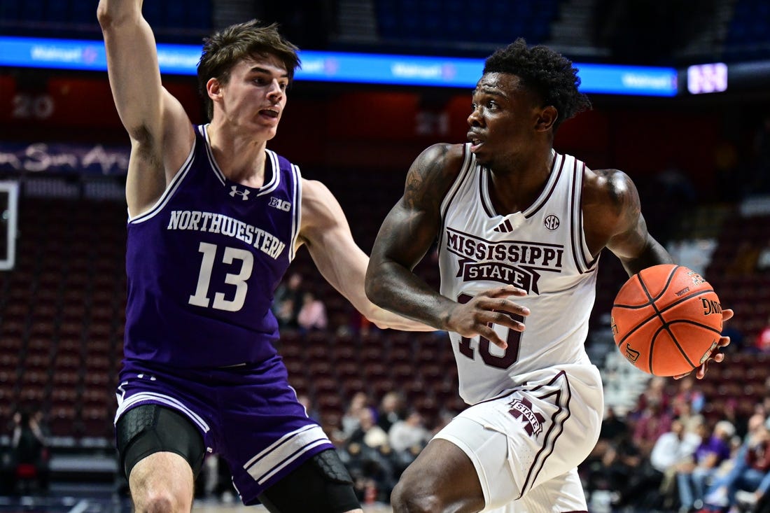 Nov 19, 2023; Uncasville, CT, USA; Mississippi State Bulldogs guard Josh Hubbard (13) looks to shoot the ball defended by Northwestern Wildcats guard Brooks Barnhizer (13) during the second half at Mohegan Sun Arena. Mandatory Credit: Mark Smith-USA TODAY Sports