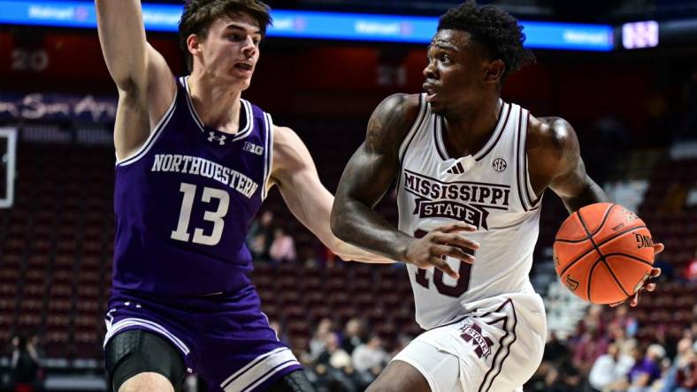 Nov 19, 2023; Uncasville, CT, USA; Mississippi State Bulldogs guard Josh Hubbard (13) looks to shoot the ball defended by Northwestern Wildcats guard Brooks Barnhizer (13) during the second half at Mohegan Sun Arena. Mandatory Credit: Mark Smith-USA TODAY Sports