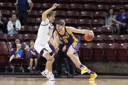 Nov 19, 2023; Charleston, SC, USA; LSU Tigers forward Will Baker (9) drives the ball around Wake Forest Demon Deacons forward Zach Keller (25) in the first half at TD Arena. Mandatory Credit: David Yeazell-USA TODAY Sports