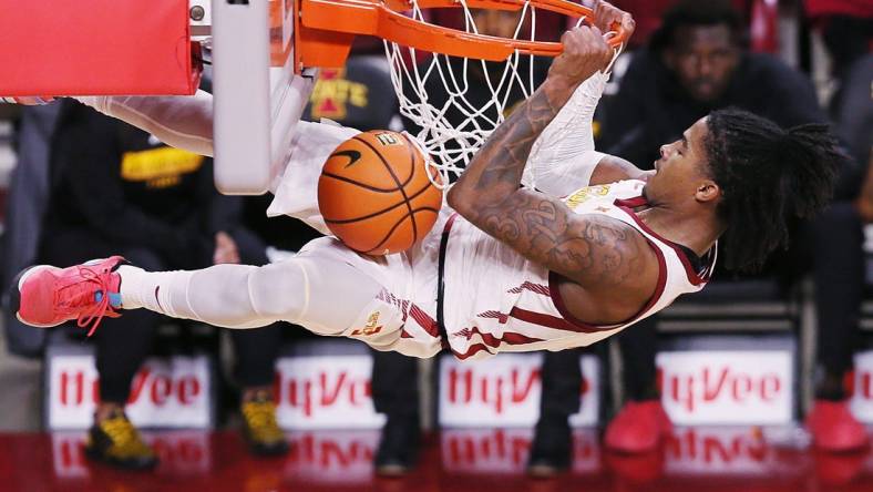 Iowa State Cyclones guard Keshon Gilbert (10) hangs in the basket after a dunk against Grambling State during the first half in the NCAA men's basketball at Hilton Coliseum on Sunday, Nov. 19, 2023, in Ames, Iowa.