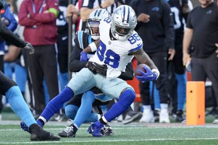 Nov 19, 2023; Charlotte, North Carolina, USA;  Dallas Cowboys wide receiver CeeDee Lamb (88) is hit as he makes a catch by Carolina Panthers safety Vonn Bell (24) during the second half at Bank of America Stadium. Mandatory Credit: Jim Dedmon-USA TODAY Sports