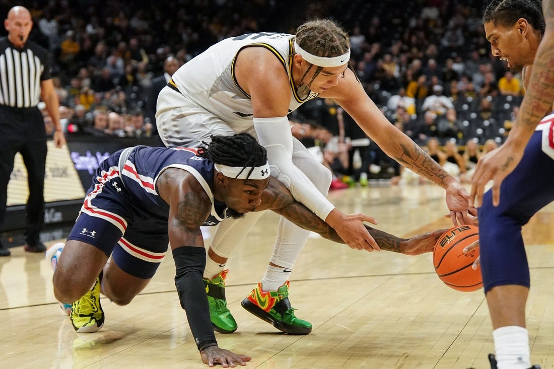 Nov 19, 2023; Columbia, Missouri, USA; Missouri Tigers forward Noah Carter (35) and Jackson State Tigers forward Jordan O'Neal (23) and guard Chase Adams (10) fight for a loose ball during the first half at Mizzou Arena. Mandatory Credit: Denny Medley-USA TODAY Sports