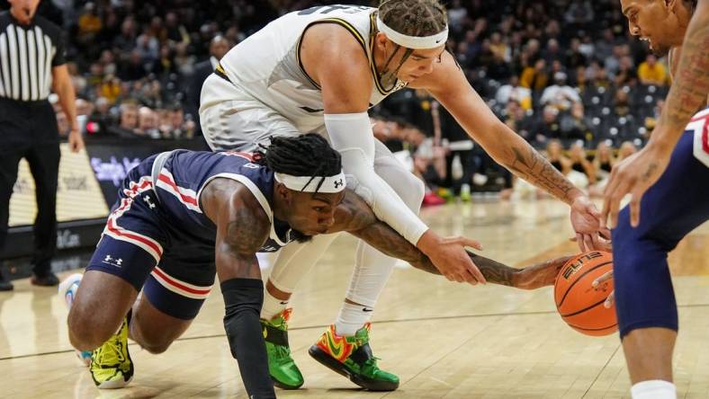 Nov 19, 2023; Columbia, Missouri, USA; Missouri Tigers forward Noah Carter (35) and Jackson State Tigers forward Jordan O'Neal (23) and guard Chase Adams (10) fight for a loose ball during the first half at Mizzou Arena. Mandatory Credit: Denny Medley-USA TODAY Sports