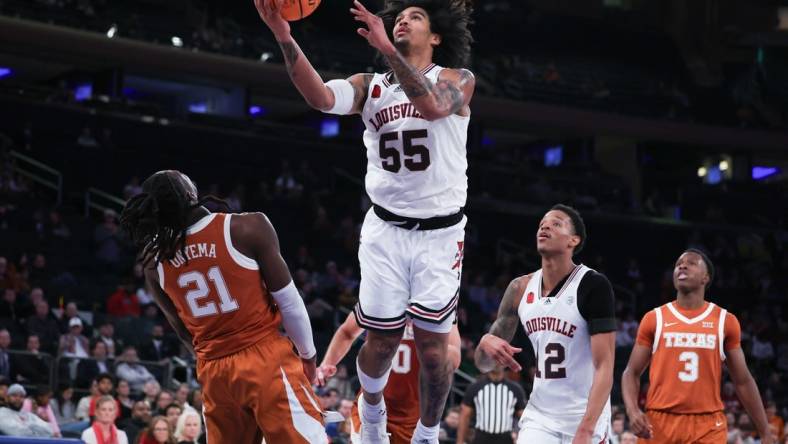 Nov 19, 2023; New York, New York, USA; Louisville Cardinals guard Skyy Clark (55) goes to the basket against Texas Longhorns forward Ze'Rik Onyema (21) during the second half at Madison Square Garden. Mandatory Credit: Vincent Carchietta-USA TODAY Sports