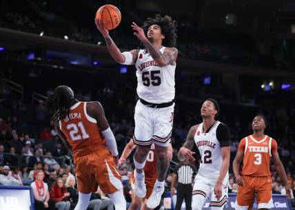 Nov 19, 2023; New York, New York, USA; Louisville Cardinals guard Skyy Clark (55) goes to the basket against Texas Longhorns forward Ze'Rik Onyema (21) during the second half at Madison Square Garden. Mandatory Credit: Vincent Carchietta-USA TODAY Sports