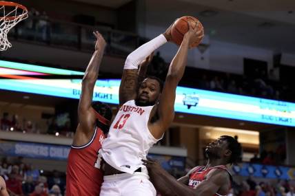 Nov 19, 2023; Charleston, SC, USA; Houston Cougars forward J'Wan Roberts (13) gets a rebound in the first half against the Dayton Flyers at TD Arena. Mandatory Credit: David Yeazell-USA TODAY Sports