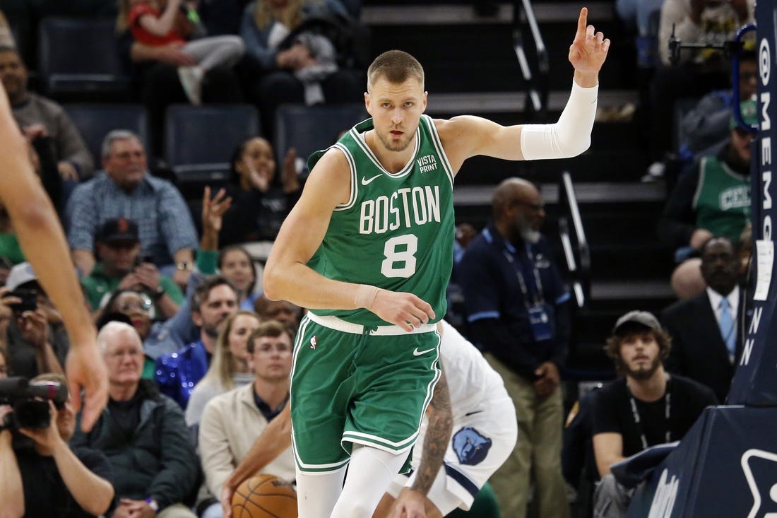 Nov 19, 2023; Memphis, Tennessee, USA; Boston Celtics center Kristaps Porzingis (8) reacts after a dunk during the second half against the Memphis Grizzlies at FedExForum. Mandatory Credit: Petre Thomas-USA TODAY Sports