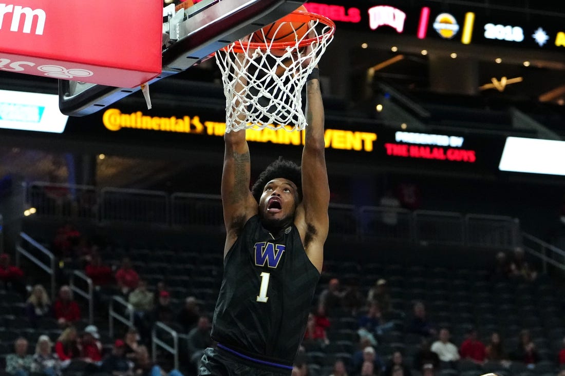 Nov 19, 2023; Las Vegas, NV, USA; Washington Huskies forward Keion Brooks Jr. (1) dunks against the San Diego State Aztecs during the second half at T-Mobile Arena. Mandatory Credit: Stephen R. Sylvanie-USA TODAY Sports