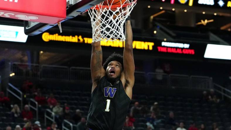 Nov 19, 2023; Las Vegas, NV, USA; Washington Huskies forward Keion Brooks Jr. (1) dunks against the San Diego State Aztecs during the second half at T-Mobile Arena. Mandatory Credit: Stephen R. Sylvanie-USA TODAY Sports