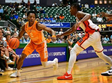 Nov 20, 2023; Honolulu, Hawaii, USA;  

Tennessee Volunteers guard Jordan Gainey (2) drives the ball around Syracuse Orange guard JJ Starling (2) during the first period at SimpliFi Arena at Stan Sheriff Center. Mandatory Credit: Steven Erler-USA TODAY Sports