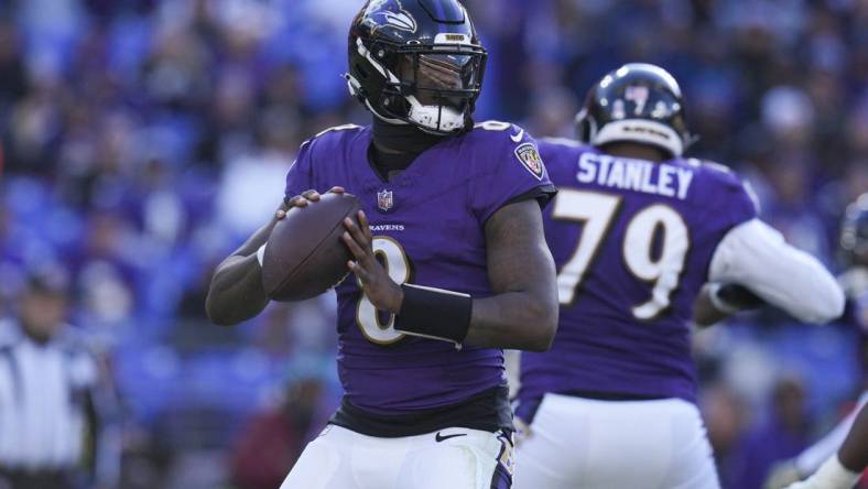 Nov 12, 2023; Baltimore, Maryland, USA;  Baltimore Ravens quarterback Lamar Jackson (8) passes the ball against the Cleveland Browns during the second half at M&T Bank Stadium. Mandatory Credit: Jessica Rapfogel-USA TODAY Sports