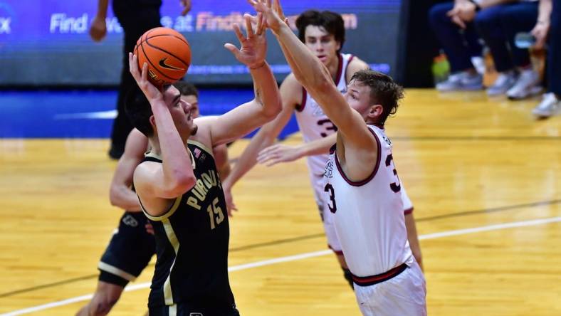 Nov 20, 2023; Honolulu, Hawaii, USA;  

Purdue Boilermakers center Zach Edey (15) shoots while being defended by Gonzaga Bulldogs forward Ben Gregg (33) during the first half at SimpliFi Arena at Stan Sheriff Center. Mandatory Credit: Steven Erler-USA TODAY Sports