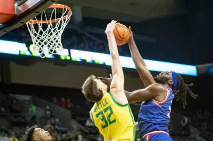 Oregon center Nate Bittle blocks a shot by Tennessee State forward Jason Jitoboh as the Oregon Ducks host Tennessee State Friday, Nov. 17, 2023, at Matthew Knight Arena in Eugene, Ore.