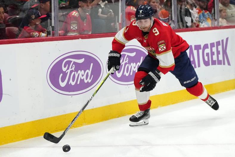 Nov 20, 2023; Sunrise, Florida, USA; Florida Panthers center Sam Bennett (9) chases a loose puck during the first period against the Edmonton Oilers at Amerant Bank Arena. Mandatory Credit: Jasen Vinlove-USA TODAY Sports