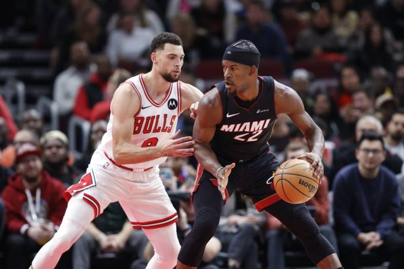 Nov 20, 2023; Chicago, Illinois, USA; Chicago Bulls guard Zach LaVine (8) defends against Miami Heat forward Jimmy Butler (22) during the first half at United Center. Mandatory Credit: Kamil Krzaczynski-USA TODAY Sports