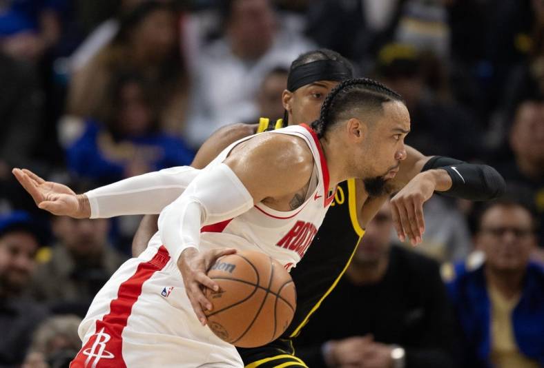 Nov 20, 2023; San Francisco, California, USA; Houston Rockets guard Dillon Brooks (9) drives around Golden State Warriors guard Moses Moody (4) during the first quarter at Chase Center. Mandatory Credit: D. Ross Cameron-USA TODAY Sports