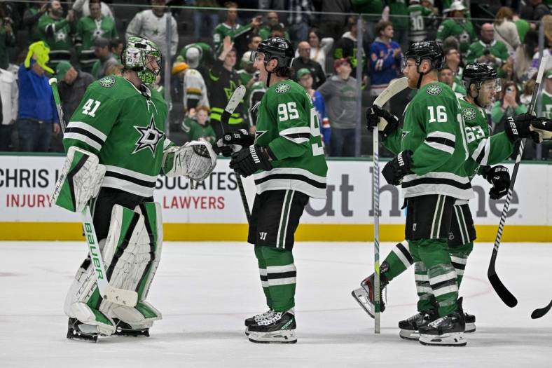 Nov 20, 2023; Dallas, Texas, USA; Dallas Stars goaltender Scott Wedgewood (41) and center Matt Duchene (95) and center Joe Pavelski (16) celebrate on the ice after the Stars victory over the New York Rangers at the American Airlines Center. Mandatory Credit: Jerome Miron-USA TODAY Sports