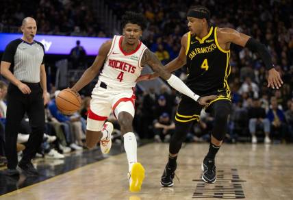 Nov 20, 2023; San Francisco, California, USA; Houston Rockets guard Jalen Green (4) dribbles against Golden State Warriors guard Moses Moody (4) during the third quarter at Chase Center. Mandatory Credit: D. Ross Cameron-USA TODAY Sports