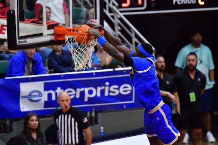 Nov 20, 2023; Honolulu, Hawaii, USA;  UCLA Bruins forward Adem Bona (3) dunks the ball against the Marquette Golden Eagles during the second period at SimpliFi Arena at Stan Sheriff Center. Mandatory Credit: Steven Erler-USA TODAY Sports