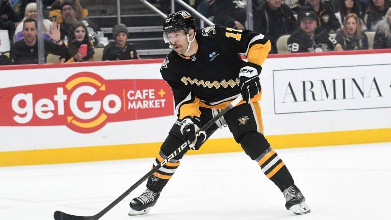 Nov 16, 2023; Pittsburgh, Pennsylvania, USA;  Pittsburgh Penguins right wing Bryan Rust (17) against the New Jersey Devils during the first period at PPG Paints Arena. Mandatory Credit: Philip G. Pavely-USA TODAY Sports