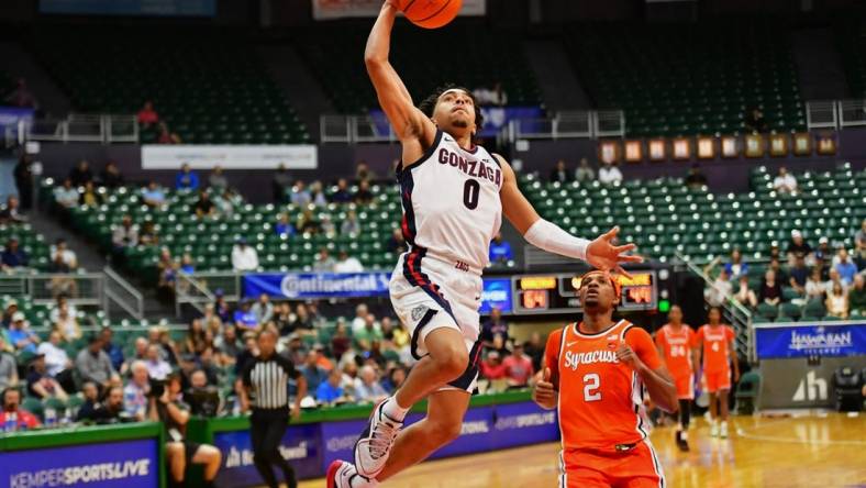 Nov 21, 2023; Honolulu, HI, USA;  

Gonzaga Bulldogs guard Ryan Nembhard (0) drives to the basket as Syracuse Orange guard JJ Starling (2) looks on during the second half at SimpliFi Arena at Stan Sheriff Center. Mandatory Credit: Steven Erler-USA TODAY Sports