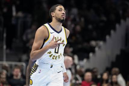 Nov 21, 2023; Atlanta, Georgia, USA; Indiana Pacers guard Tyrese Haliburton (0) reacts after a three point basket against the Atlanta Hawks during the first half at State Farm Arena. Mandatory Credit: Dale Zanine-USA TODAY Sports