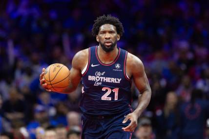 Nov 21, 2023; Philadelphia, Pennsylvania, USA; Philadelphia 76ers center Joel Embiid (21) dribbles the ball against the Cleveland Cavaliers during the fourth quarter at Wells Fargo Center. Mandatory Credit: Bill Streicher-USA TODAY Sports