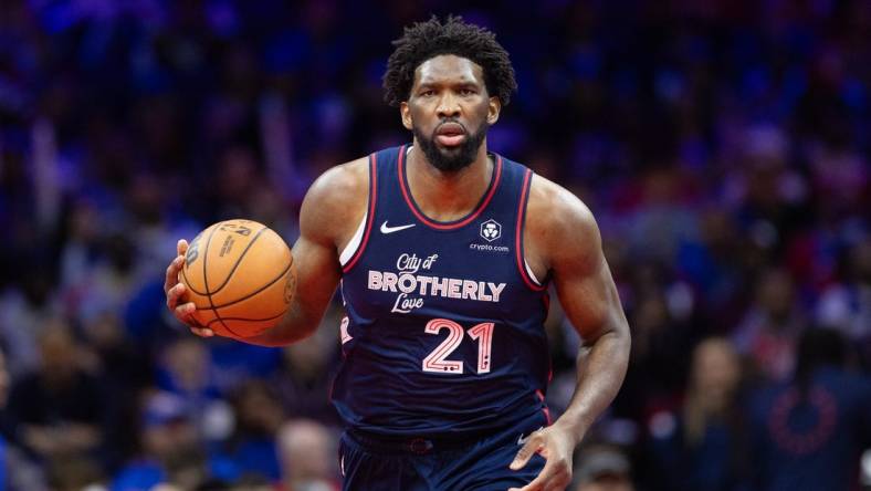 Nov 21, 2023; Philadelphia, Pennsylvania, USA; Philadelphia 76ers center Joel Embiid (21) dribbles the ball against the Cleveland Cavaliers during the fourth quarter at Wells Fargo Center. Mandatory Credit: Bill Streicher-USA TODAY Sports