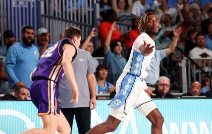Nov 22, 2023; Paradise Island, BAHAMAS;  North Carolina Tar Heels forward Jae'Lyn Withers (24) reacts after scoring  over Northern Iowa Panthers forward Kyle Pock (22) during the first half at Imperial Arena. Mandatory Credit: Kevin Jairaj-USA TODAY Sports
